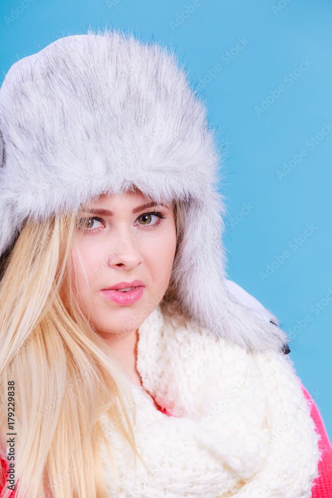 Blonde woman in winter warm furry hat Blonde woman in winter warm furry hat