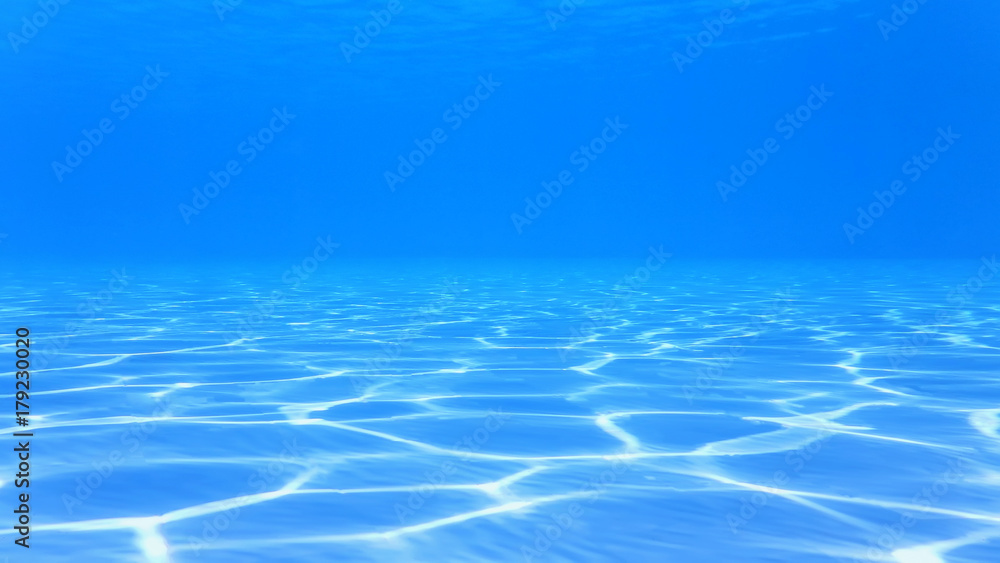 blueblue water in the pool, with reflections on the bottom of the sunlight, abstraction, background