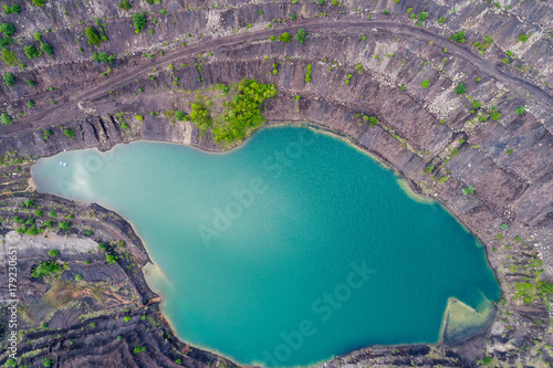 aerial view of deep mine lake in place of the mining pit photo