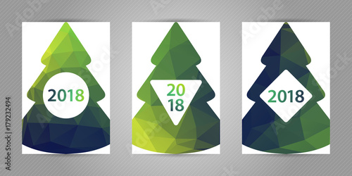 Minimalistic polygonal New Year tree on white background. Christmas greeting card with colorful green geometric texture and 2018 numbers.
