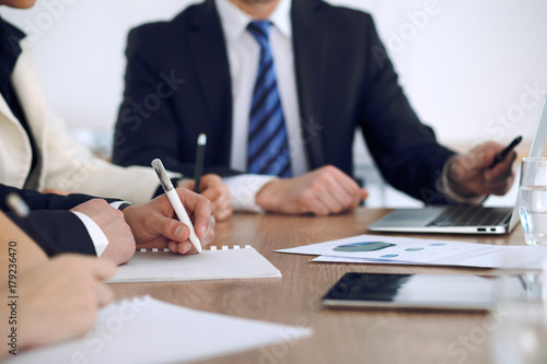 Group of business people or lawyers at meeting, hands close-up