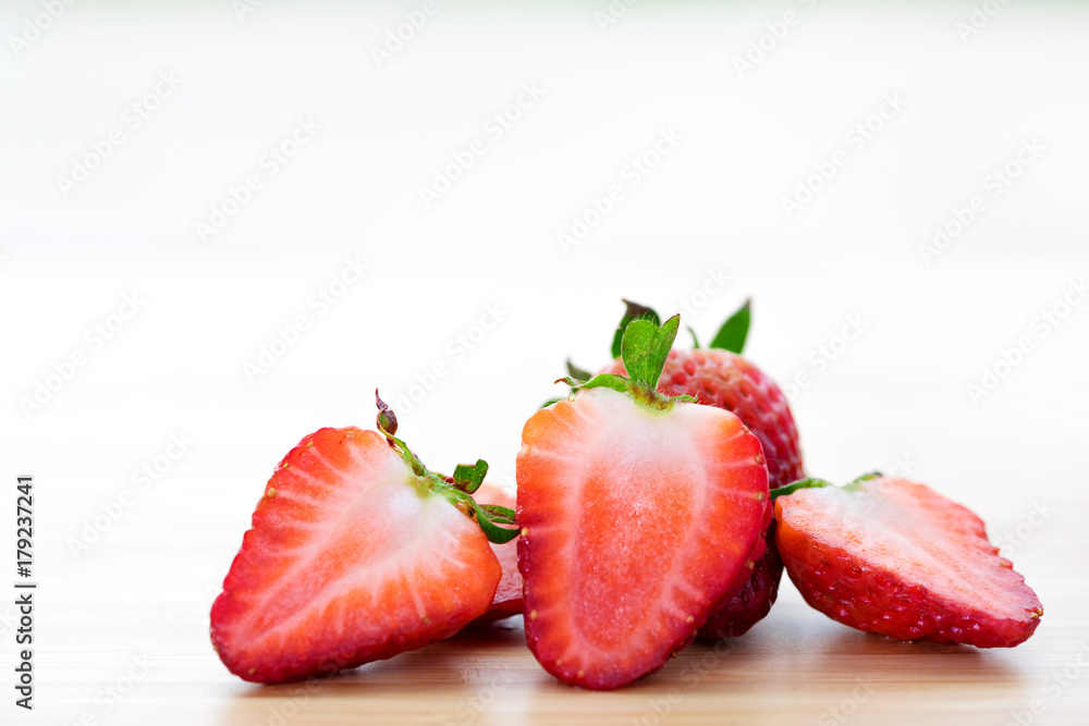 Closeup shot of fresh strawberries on wood table. Closeup shot of fresh strawberries on wood table.