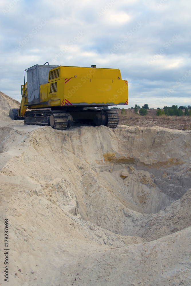 old abandoned yellow excavator in sandpit old abandoned yellow excavator in sandpit