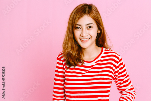 Fashion photo of young girl on pink background © Art_Photo