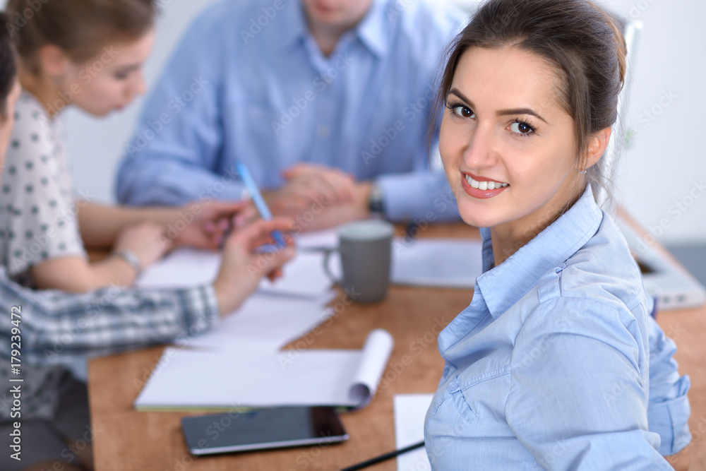 Beautiful business woman on the background of business people. Start up team. Beautiful business woman on the background of business people. Start up team.