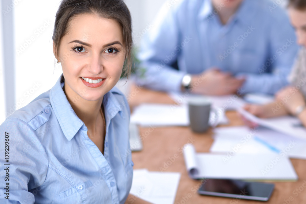 Beautiful business woman on the background of business people. Start up team. Beautiful business woman on the background of business people. Start up team.