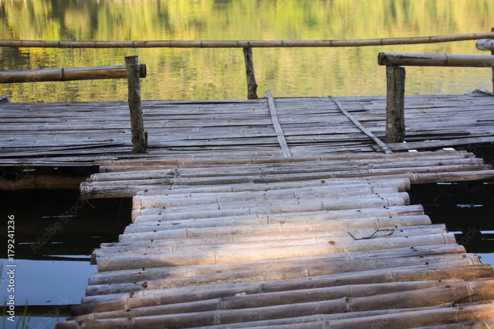 Fototapeta premium Waterside wood pier made of bamboo