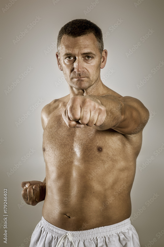 Fototapeta premium a middle age taekwondo fighter in basic position