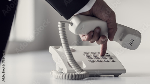 Dialing a phone number on a classical white landline device