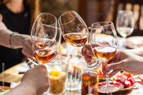 Rose wine in hand