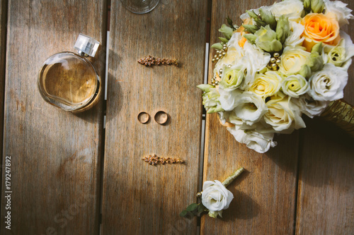 Wedding accessories. Bouquet, rings, parfume, earrings, wedding invitations. Accessories of bride Wedding details photo