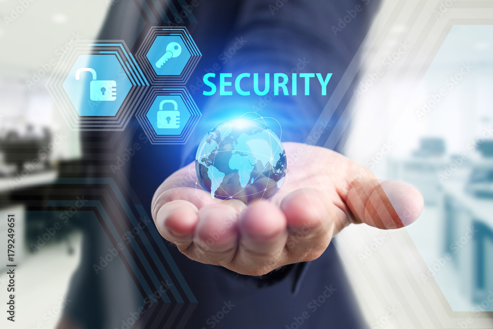 The concept of business, technology, the Internet and the network. A young entrepreneur working on a virtual screen of the future and sees the inscription: Security The concept of business, technology, the Internet and the network. A young entrepreneur working on a virtual screen of the future and sees the inscription: Security