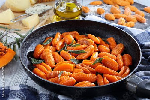 pumpkin gnocchi in a skillet, close-up photo