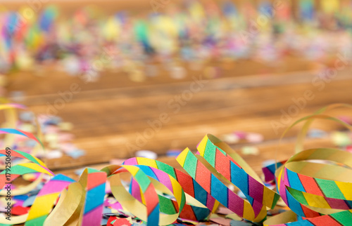 streamers and confetti wooden background