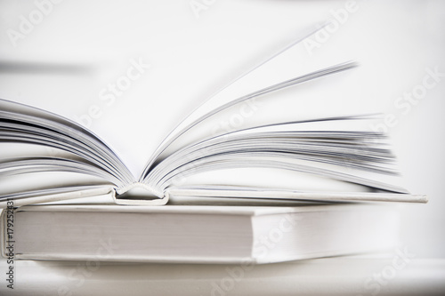 Macro view of book pages. Love reading concept with two white books © maram
