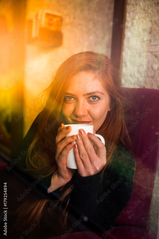 Beautiful girl drinking coffee at the coffee shop Beautiful girl drinking coffee at the coffee shop