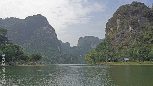 Giant karst cliffs in Ninh Binh, Vietnam. 