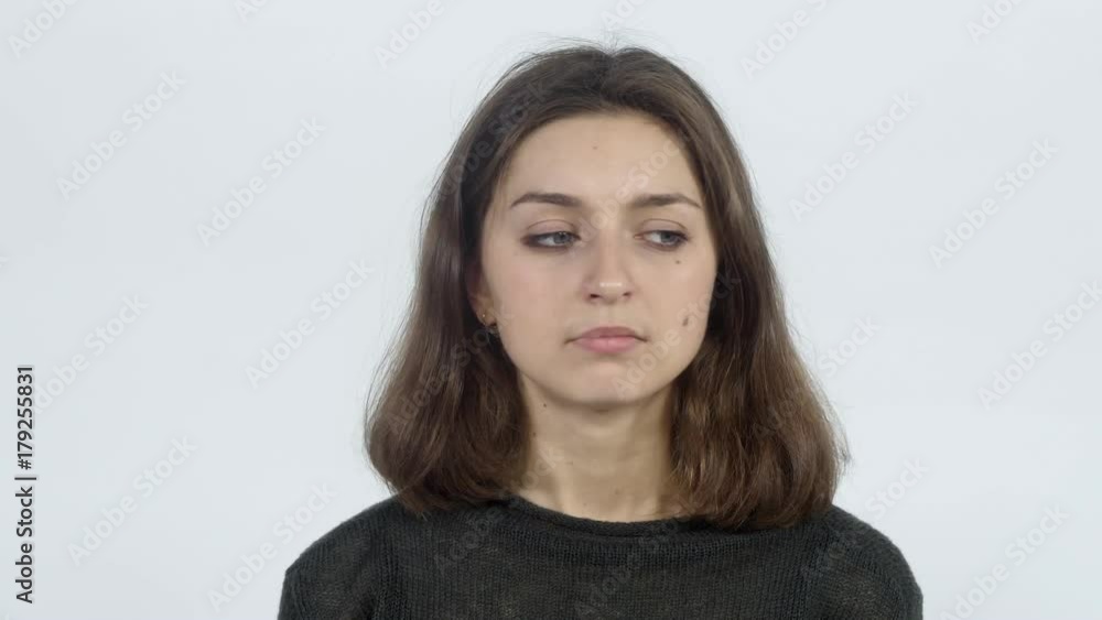 The girl shows that she smelled an unpleasant smell The girl shows that she smelled an unpleasant smell