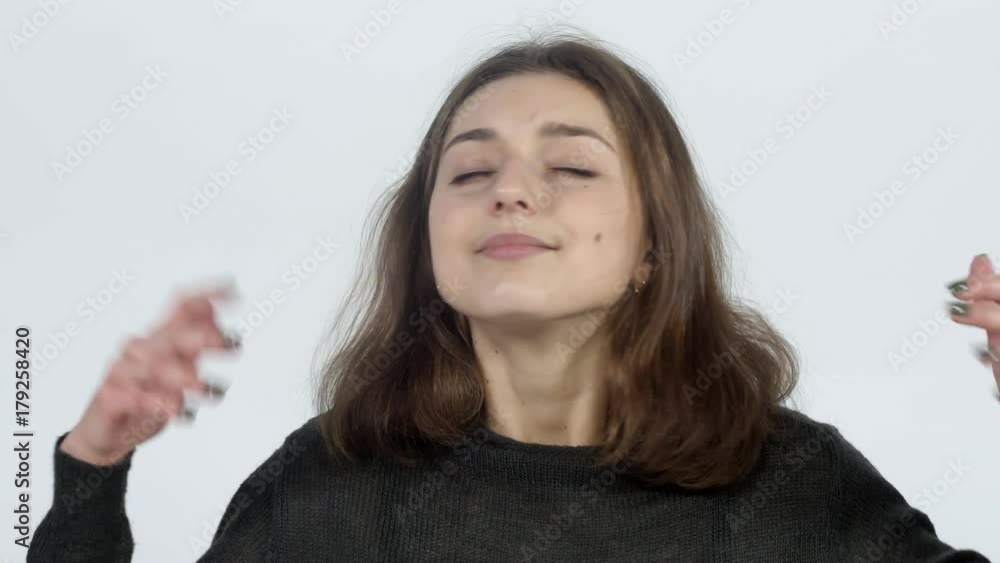 The girl feels a pleasant fragrance