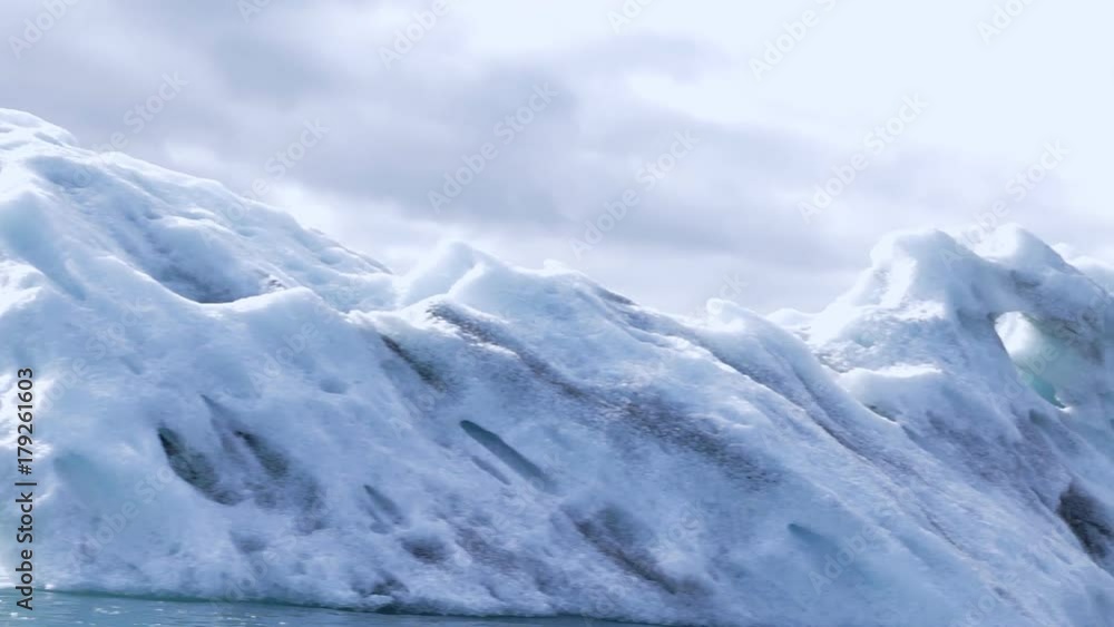 Iceland destination - famous icelandic ice lagoon, where ice goes downhill to reach ocean. Slow pan. Iceland destination - famous icelandic ice lagoon, where ice goes downhill to reach ocean. Slow pan.