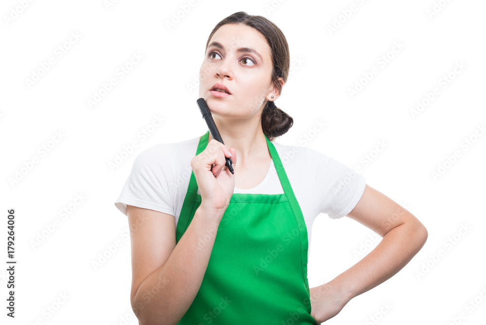 Store salesperson thinking at new checklist Store salesperson thinking at new checklist