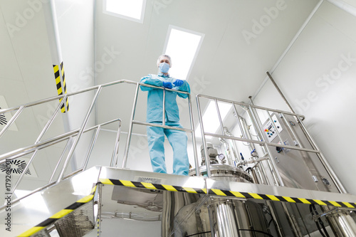 plant picture, scientist standing on ladder photo