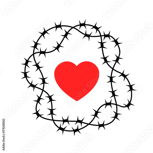 Barrier made of barbed wire as protection of heart - being protected against love and romantic emotions causing emotional hurt and harm. Refusal of rejection of intimate relationship
