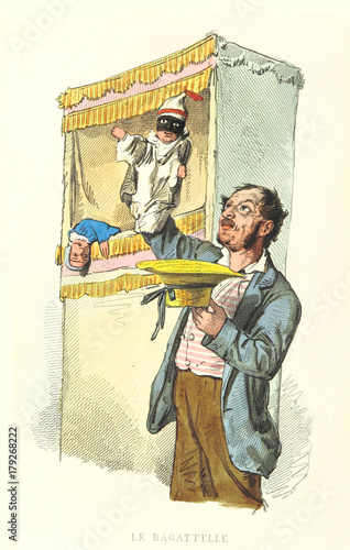 Obraz na plátně Puppeteer plays with his marionette close to his puppet box