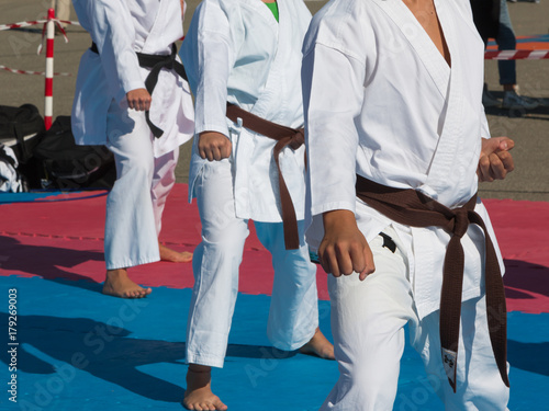 Children with Judo White Uniform doing Public Exhibition Outdoor