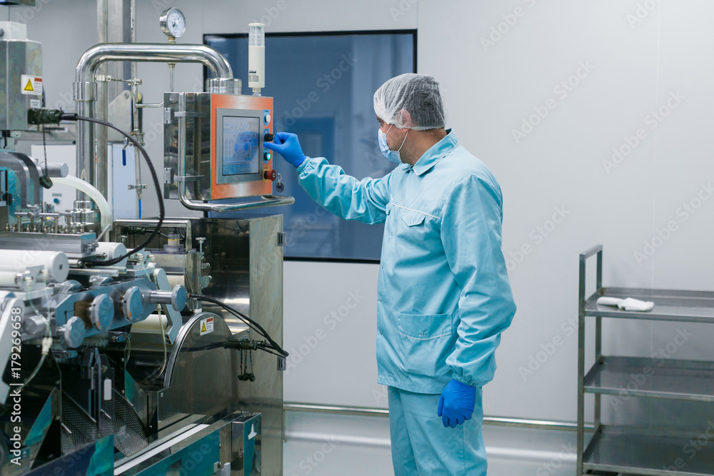 Naklejka premium scientist configures control panel