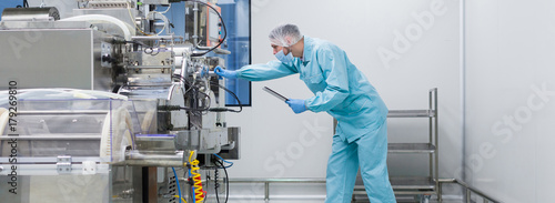 widescreen picture, scientist configures control panel photo