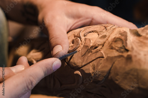 Canvas Print close up picture of woodcarver at work, handcrafting with wood