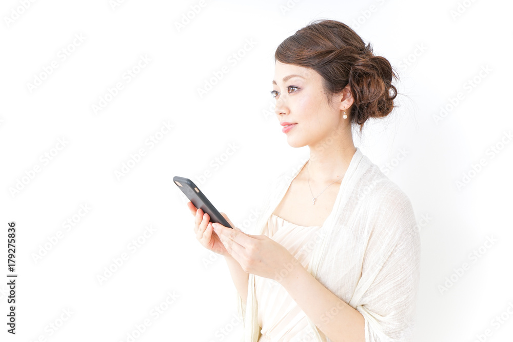 woman in dress using a smartphone woman in dress using a smartphone