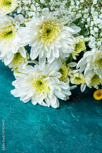 Bouquet of White and Yellow Daisies Baby Breath Gypsophila Flowers on Watercolor Turquoise Background. Valentine Birthday Mother s Day Greeting Card. Copy Space