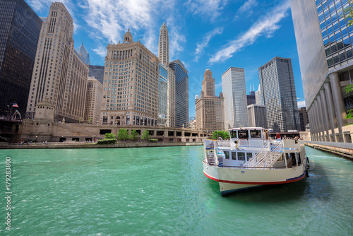 Chicago downtown and Chicago River with tourit ship during sunny day, Illinois, USA. photo