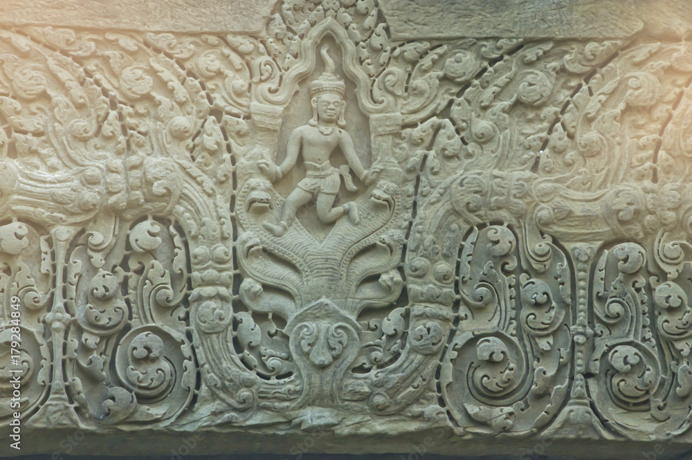 design of ancient window of buddhist asian stone pagoda in rural thailand