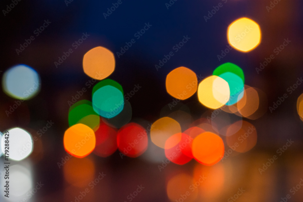  light colored spots of automobile lights and street lighting