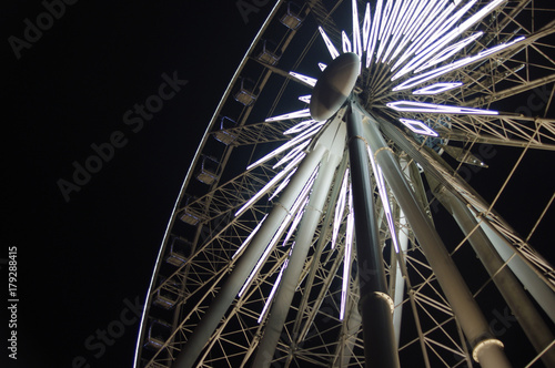 large white lights on fairs wheel at night 