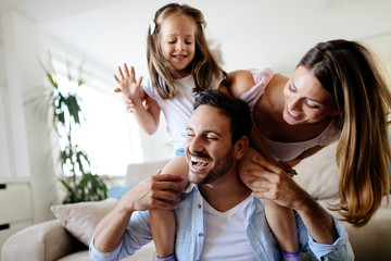 Happy family having fun times at home