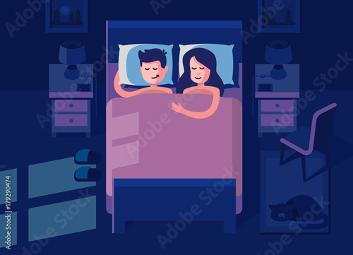 Man and woman sleeping in the bed.