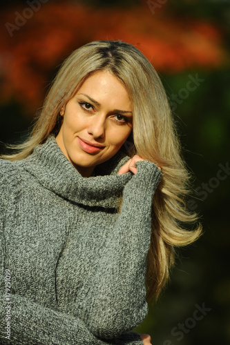 Portrait of a beautiful female model in autmn clothes outdoor.