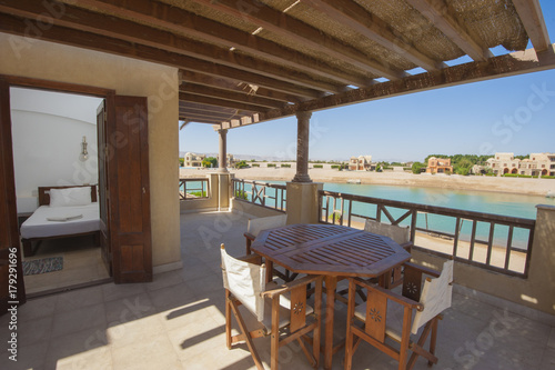 Terrace balcony from bedroom with chairs at tropical luxury villa