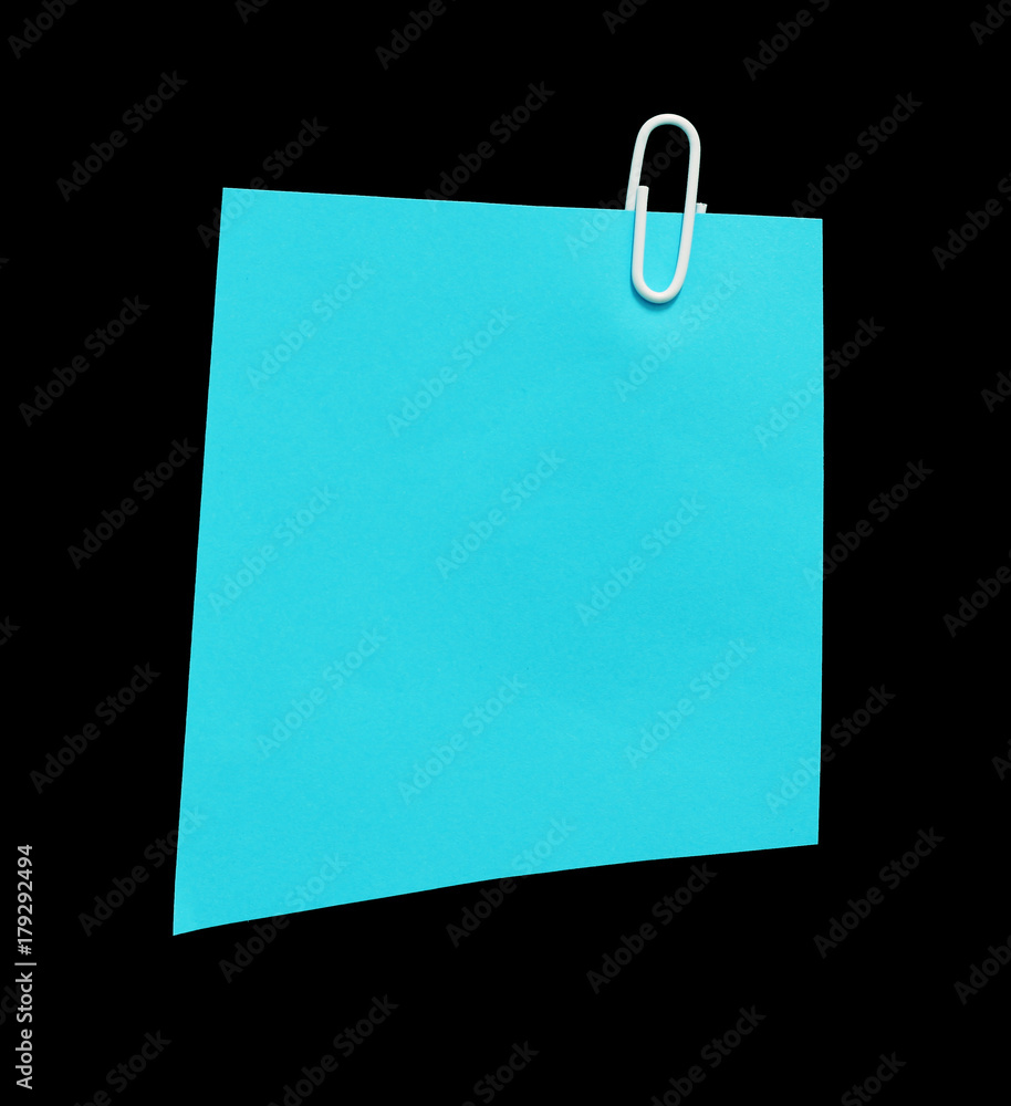 Pieces of note paper with paperclip on a black background. copy space Pieces of note paper with paperclip on a black background. copy space