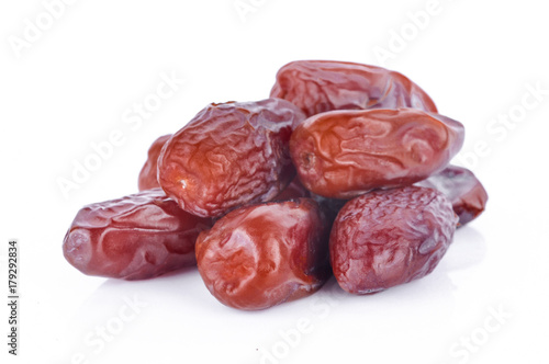 dried fruits from date palm isolated on white.
