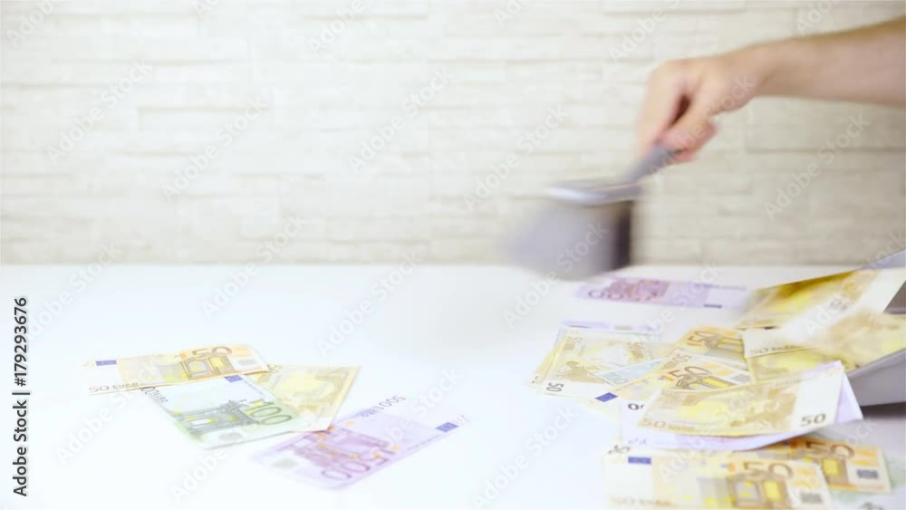 Cleaning up thrown away money with brush and dustpan 4K Cleaning up thrown away money with brush and dustpan 4K