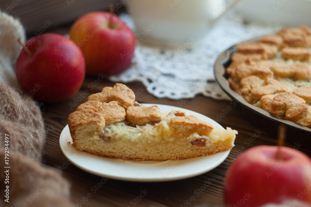 Sweet homemade apple cake with cinnamon, selective focus Sweet homemade apple cake with cinnamon, selective focus