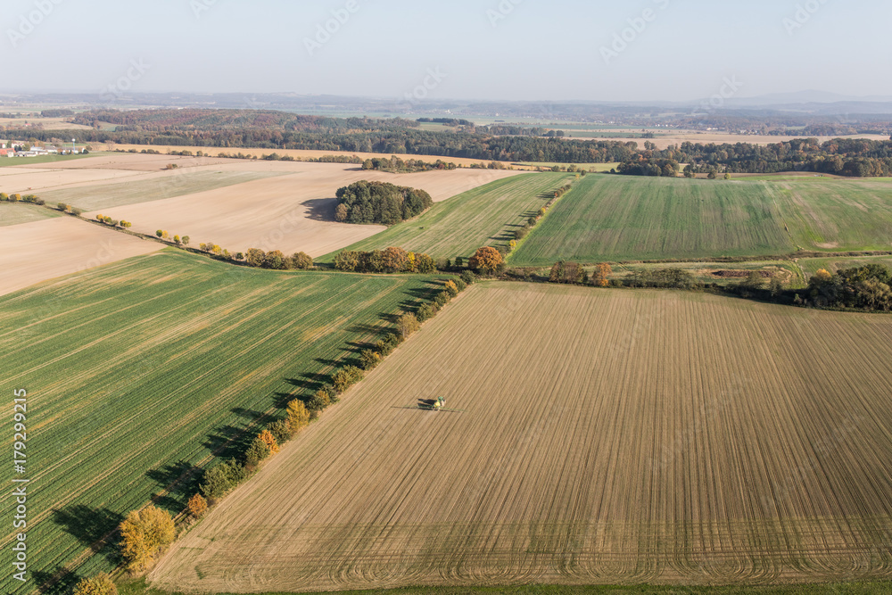 aerial view of the tractor on the harvest field
