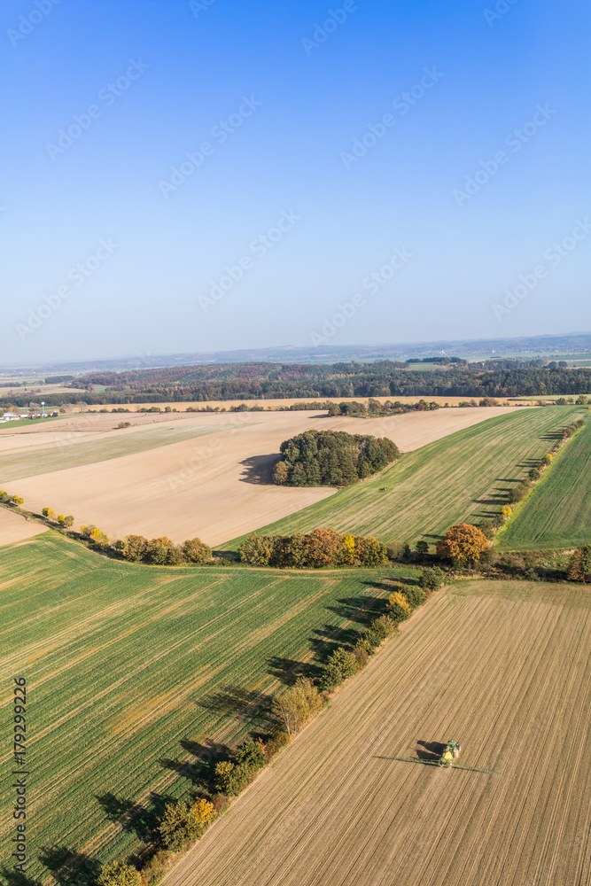 aerial view of the tractor on the harvest field