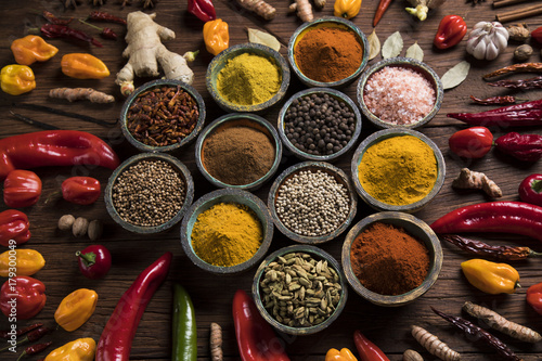 Spices and herbs in wooden bowls. Food and cuisine ingredients