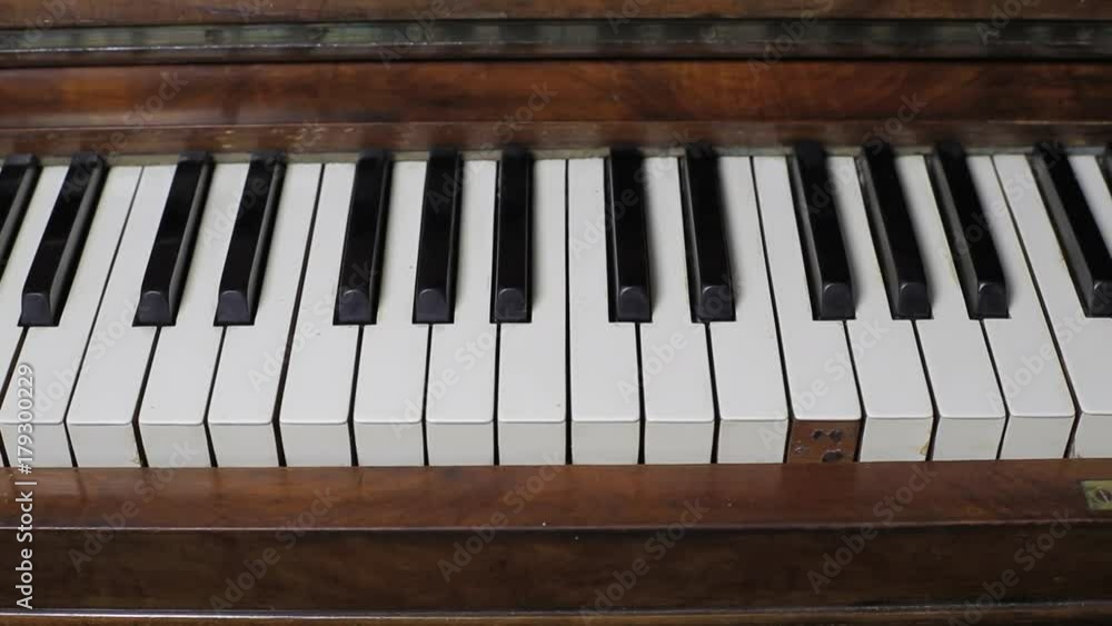 Slow tracking shot over old distressed piano keys Slow tracking shot over old distressed piano keys